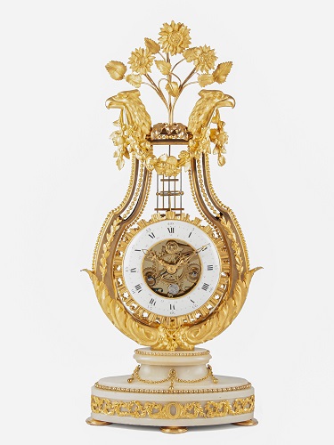 A large French Louis XVI ormolu lyre mantel clock with oscillating bezel, circa 1785.